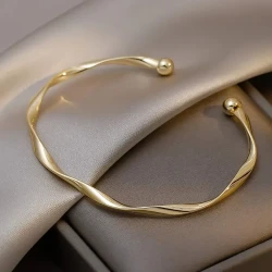 Twisted Elegance: Golden Alloy Cuff Bracelet