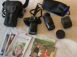 Canon T50 SLR Camera with additional lenses and OEM manuals